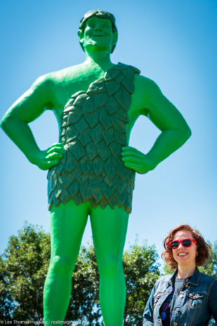 Becky poses with the Jolly Green Giant at Green Giant Statue Park in Blue Earth, Minnesota.