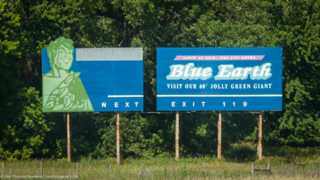 A billboard along I-90 near Blue Earth, Minnesota encourages tourists to stop and visit their 60' Jolly Green Giant.