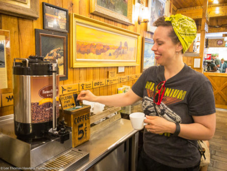 Becky drops a nickel into the box for a cup of coffee at the Wall Drug Store in Wall, South Dakota.