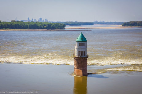 Overlooking a water intake on the Mississippi River from the Chain of Rocks Bridge north of St. Louis, Missouri. You can see the silhouette of the city skyline, including the Gateway Arch in the distance.